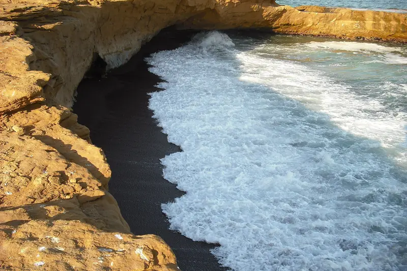 Cliffs and surf at Playa Roja, Paracas National Reserve